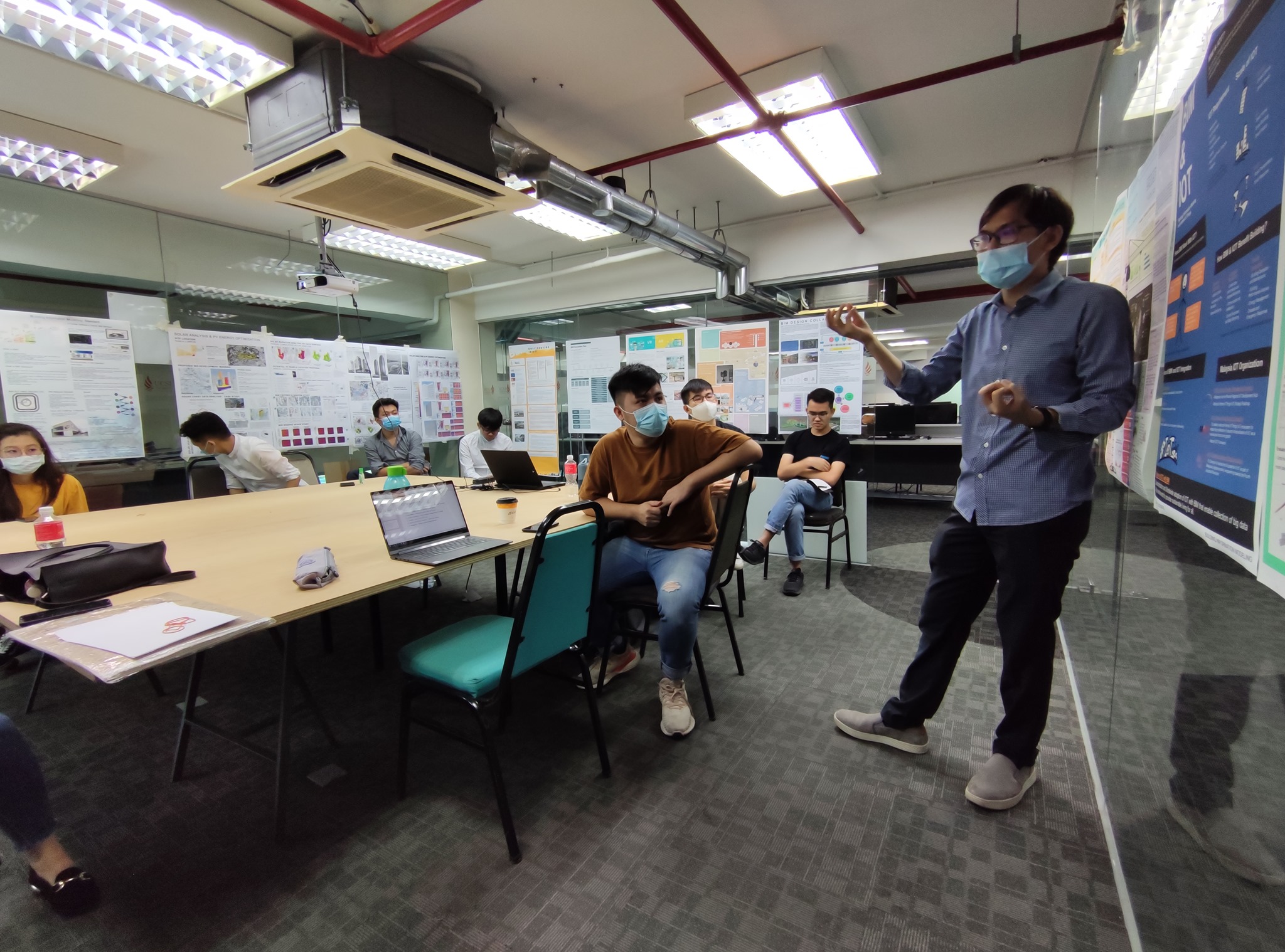 Students presenting in a building performance class